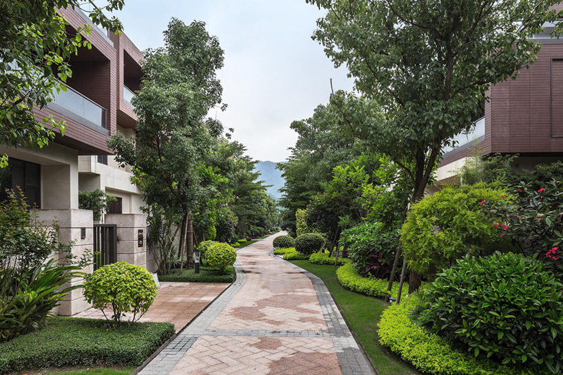 NEXT architects surrounds housing complex with water and lush greenery in china