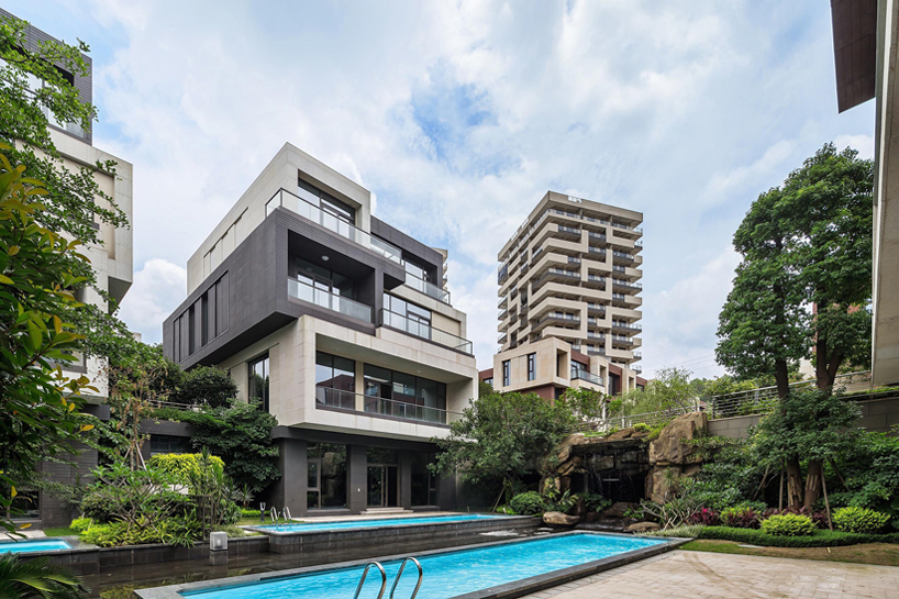 NEXT architects surrounds housing complex with water and lush greenery in china