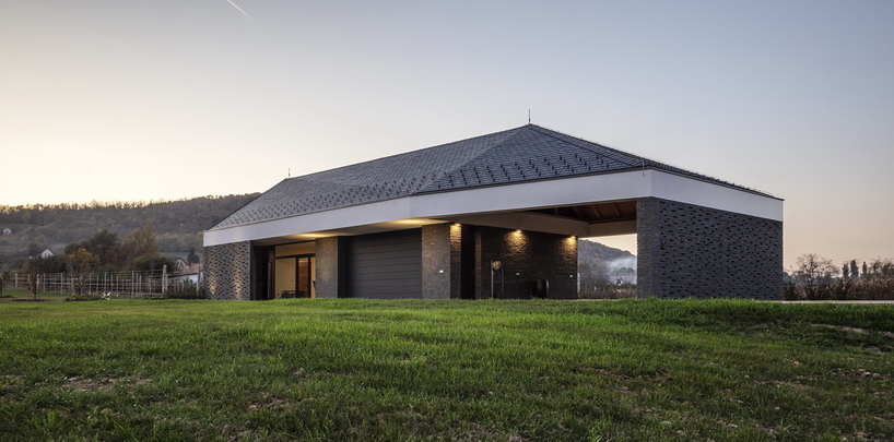 the winemaker's house by SAGRA architects builds on local traditions in rural hungary
