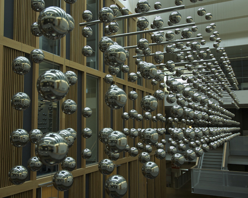 abacus sculpture by ray king floats polished spheres of stainless steel