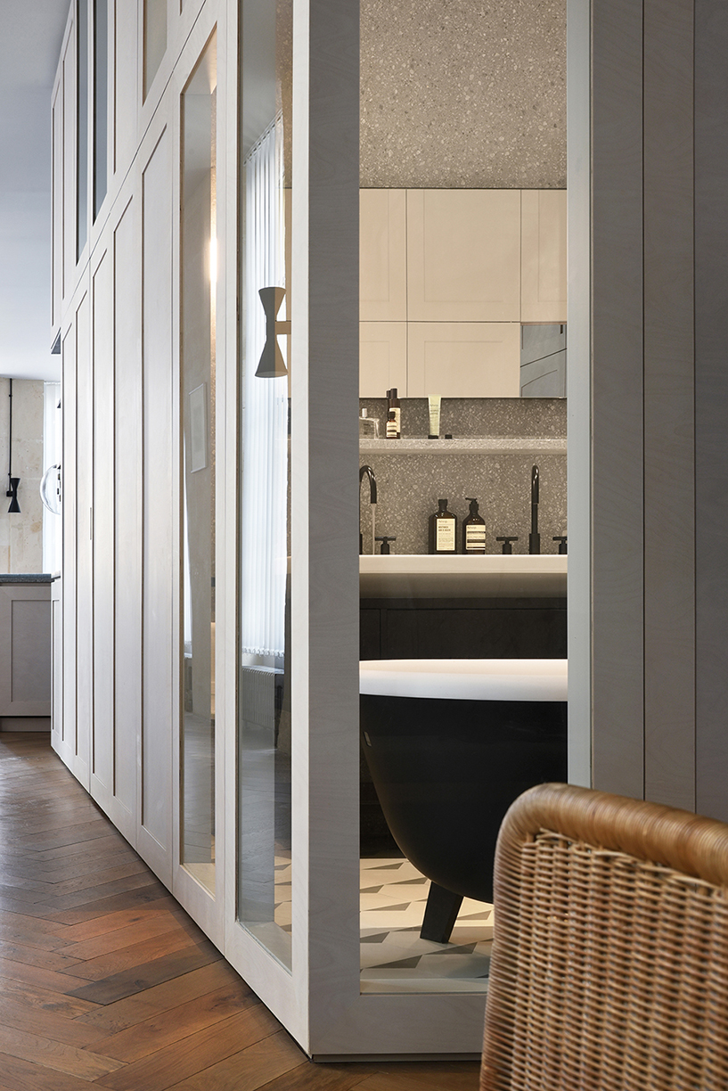 atelier du pont uses timber and terrazzo to refurbish apartment in paris designboom
