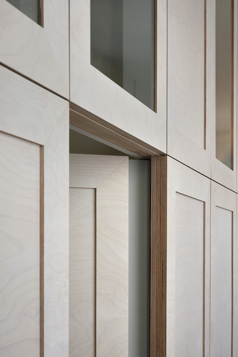 atelier du pont uses timber and terrazzo to refurbish apartment in paris designboom