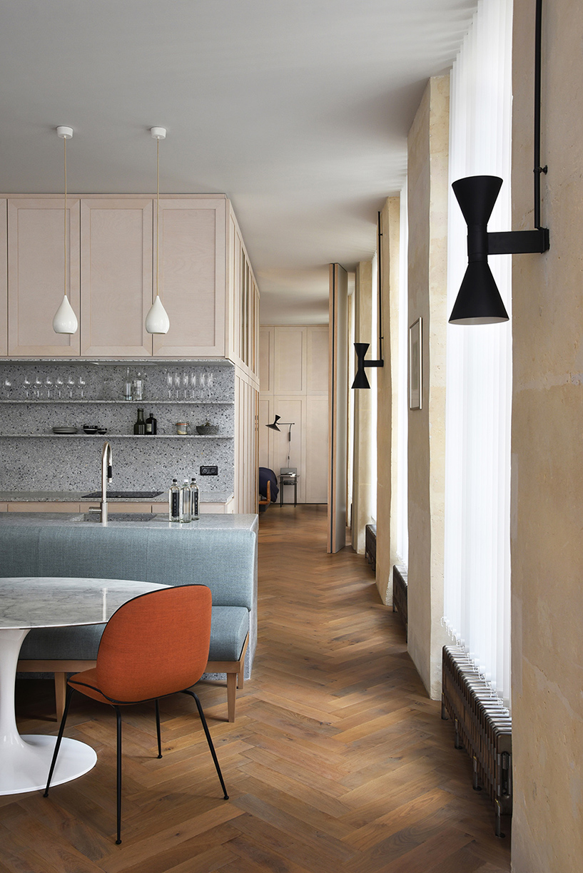 atelier du pont uses timber and terrazzo to refurbish apartment in paris designboom