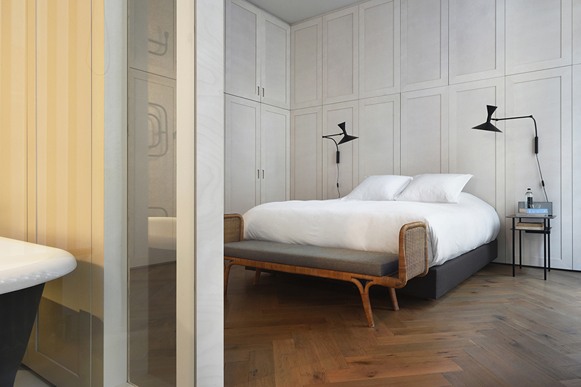 atelier du pont uses timber and terrazzo to refurbish apartment in paris designboom