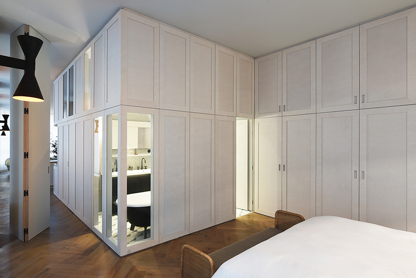 atelier du pont uses timber and terrazzo to refurbish apartment in paris