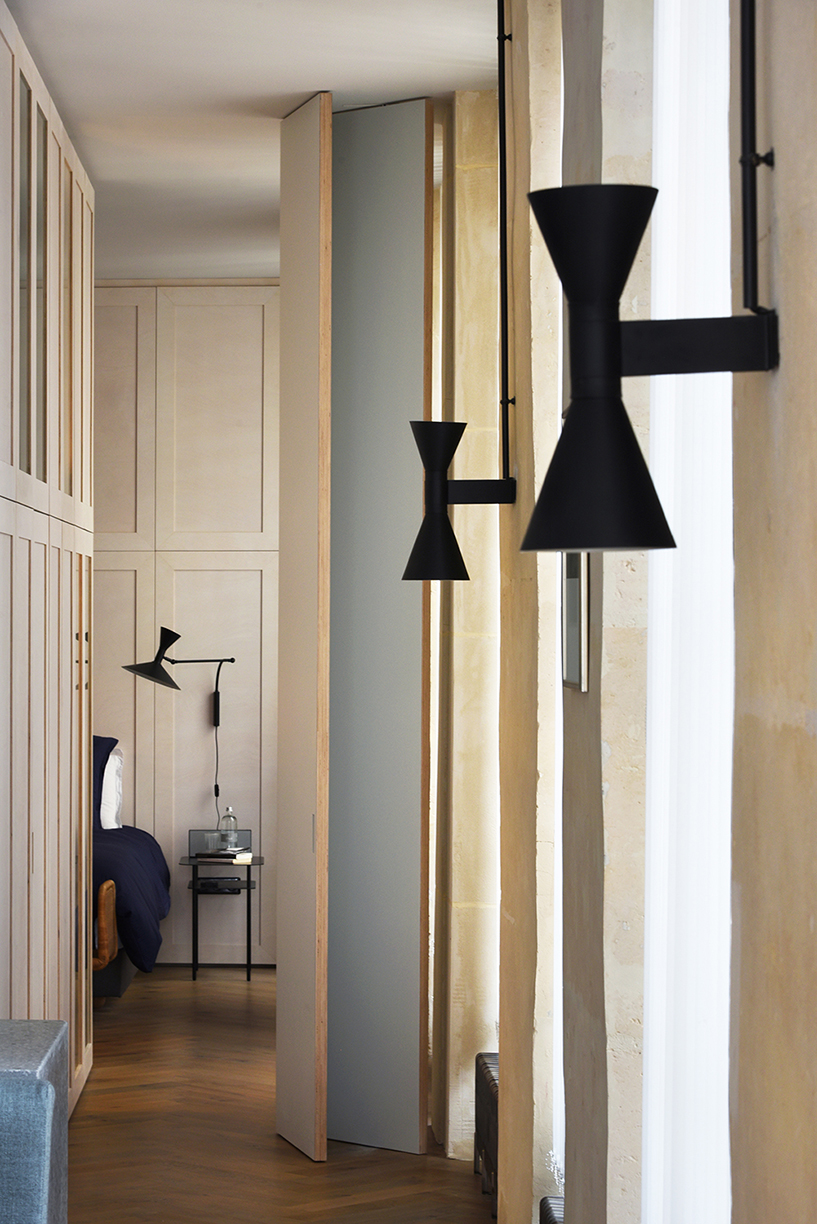 atelier du pont uses timber and terrazzo to refurbish apartment in paris designboom