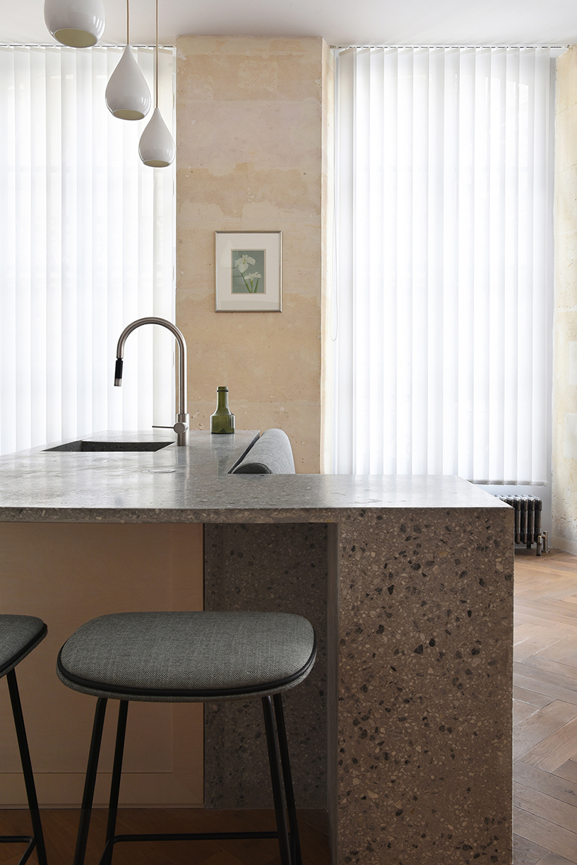 atelier du pont uses timber and terrazzo to refurbish apartment in paris designboom