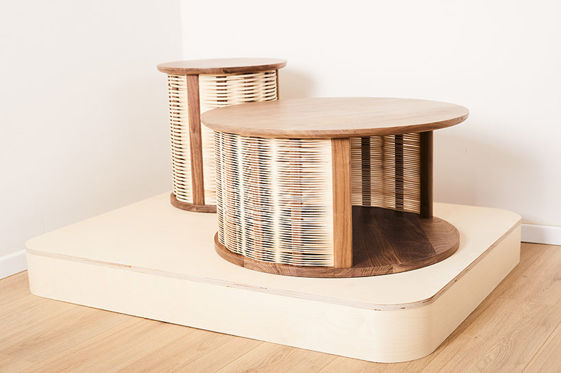 nadav caspi weaves natural wicker through walnut wood frames for table collection