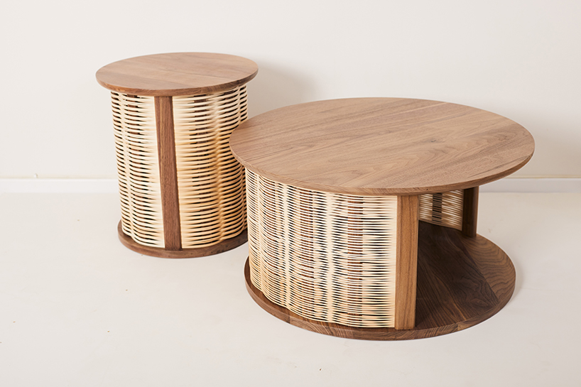 nadav caspi weaves natural wicker through walnut wood frames for table collection