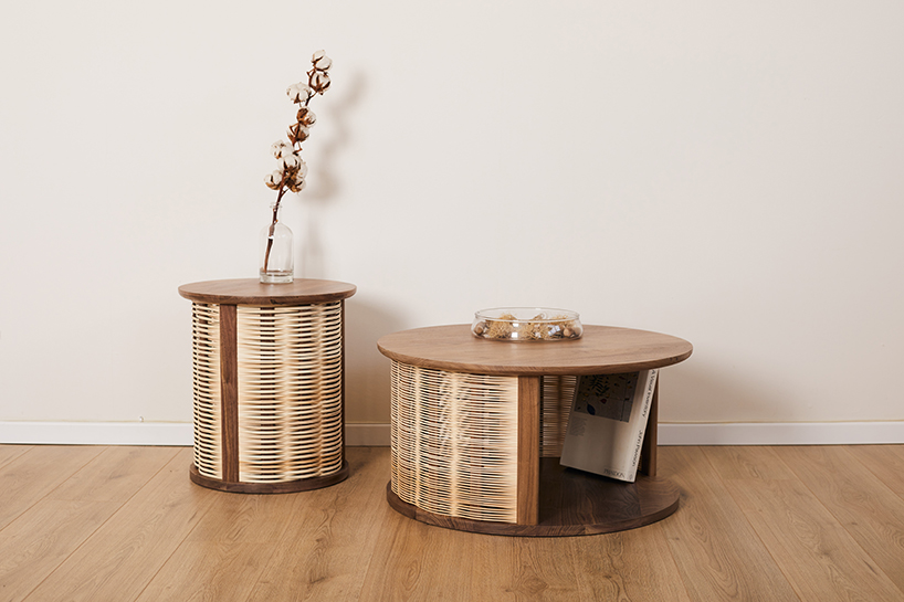 nadav caspi weaves natural wicker through walnut wood frames for table collection