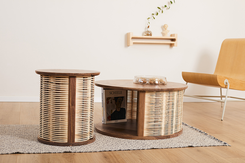 nadav caspi weaves natural wicker through walnut wood frames for table collection