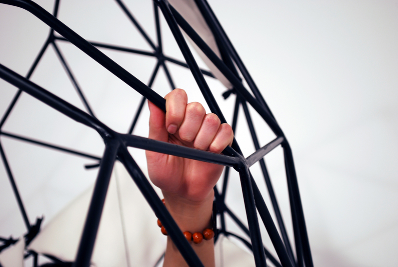 vertice   a cradle like steel cage chaise longue