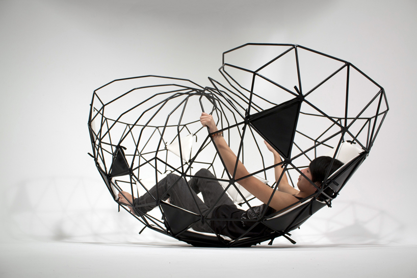 vertice   a cradle like steel cage chaise longue