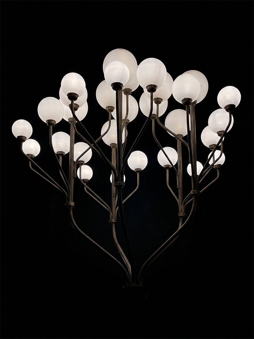 luminous globes extend from branched metal tree installation in pakistan - 10