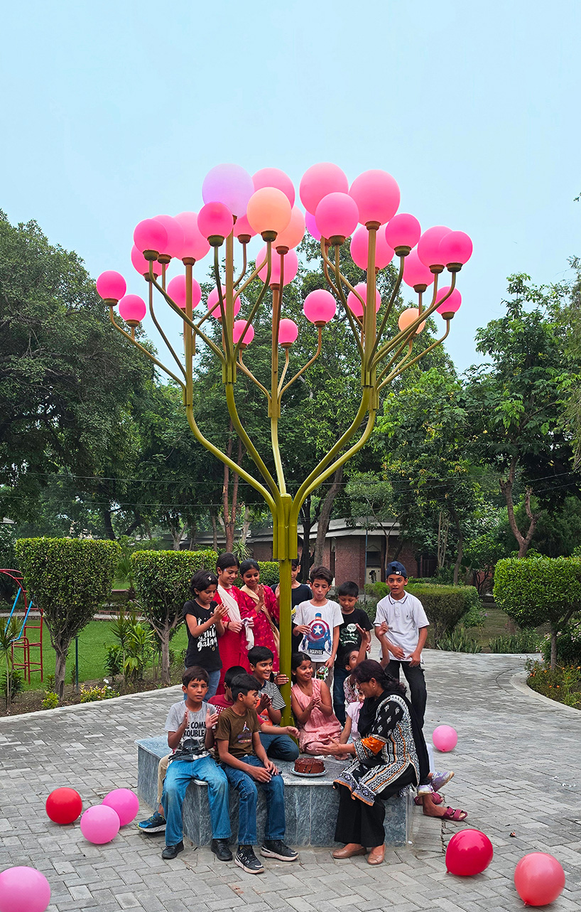 luminous globes extend from branched metal tree installation in pakistan - 3