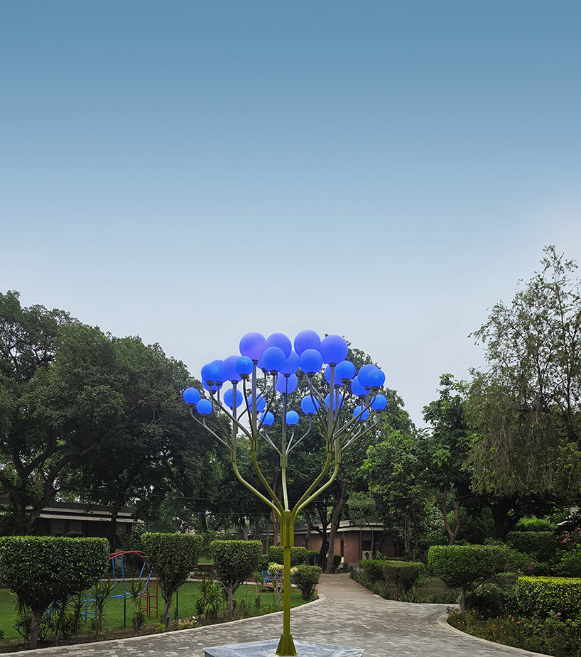 luminous globes extend from branched metal tree installation in pakistan - 7