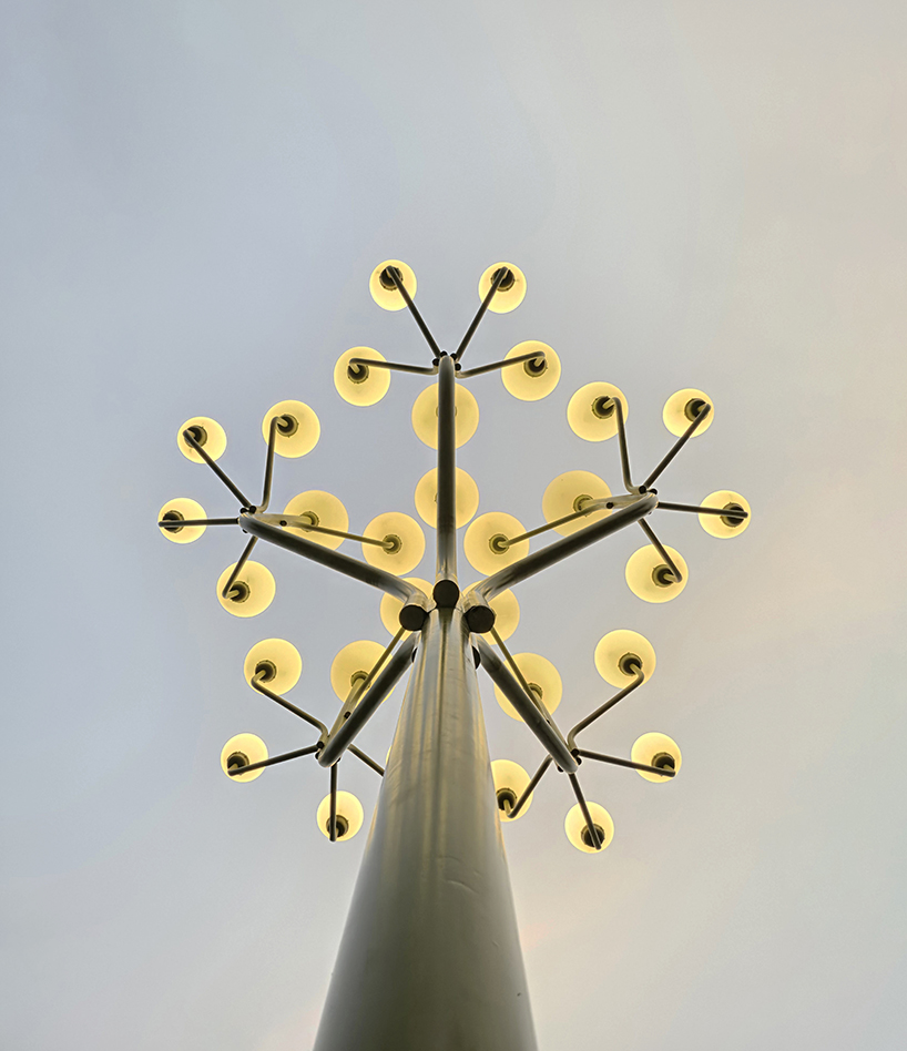luminous globes extend from branched metal tree installation in pakistan - 9