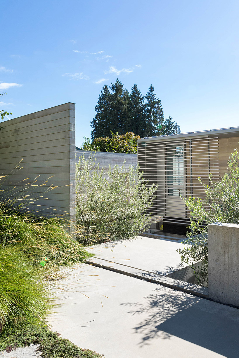 mcleod bovell wraps west vancouver residence in wood to resemble a beach house