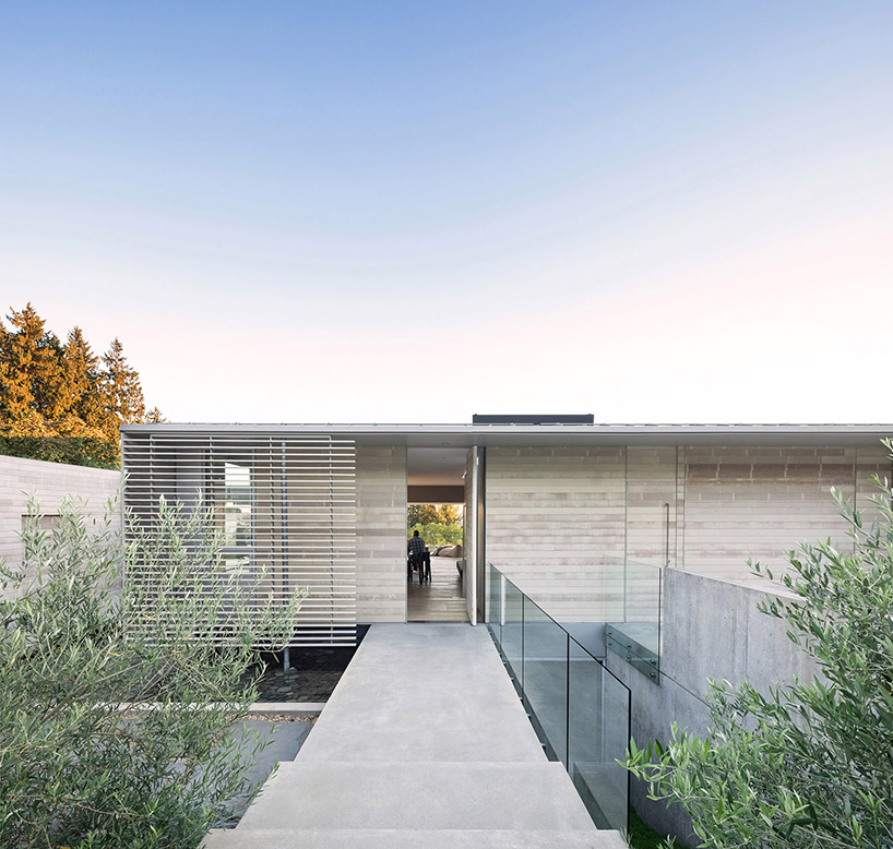 mcleod bovell wraps west vancouver residence in wood to resemble a beach house