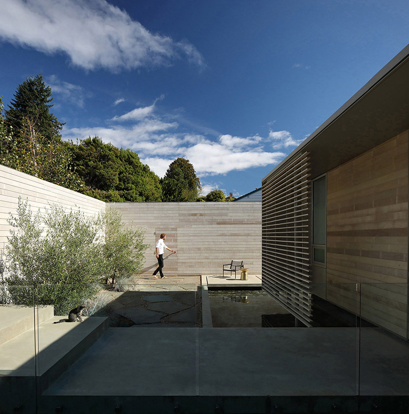 mcleod bovell wraps west vancouver residence in wood to resemble a beach house