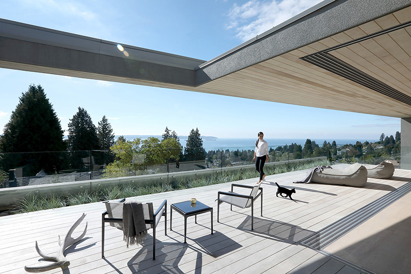 mcleod bovell wraps west vancouver residence in wood to resemble a beach house