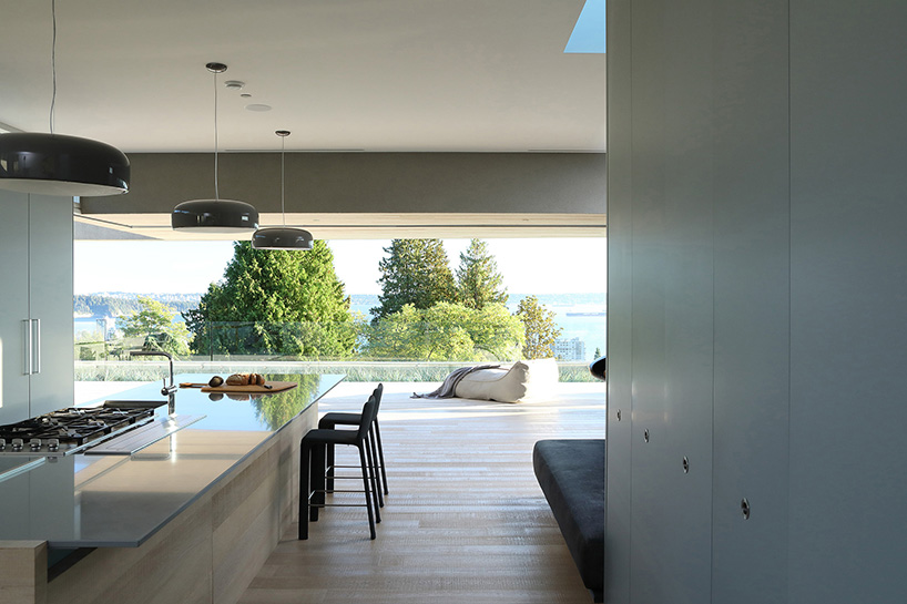 mcleod bovell wraps west vancouver residence in wood to resemble a beach house
