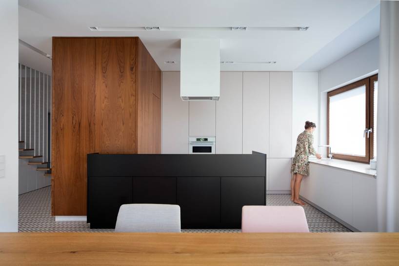 patterned flooring & accents of color complete minimalist residential interior by widawscyin poland