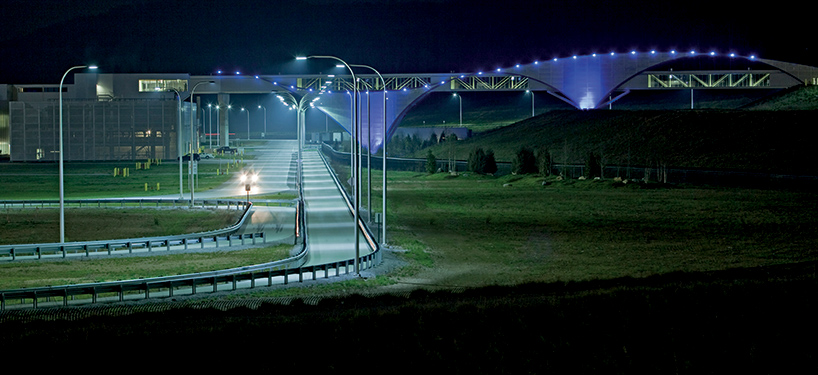 illuminated footbridge at the volkswagen production facility by SSOE group
