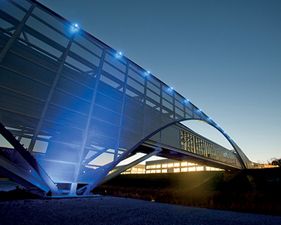 illuminated footbridge at the volkswagen production facility by SSOE group