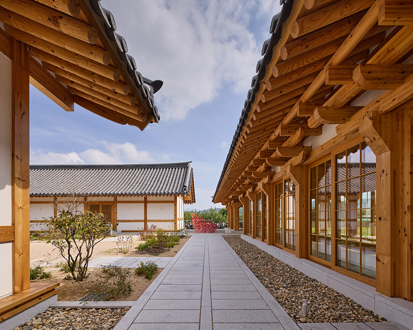 three timber rejuvenation halls by JK-AR surround a series of traditional korean courtyards - 5