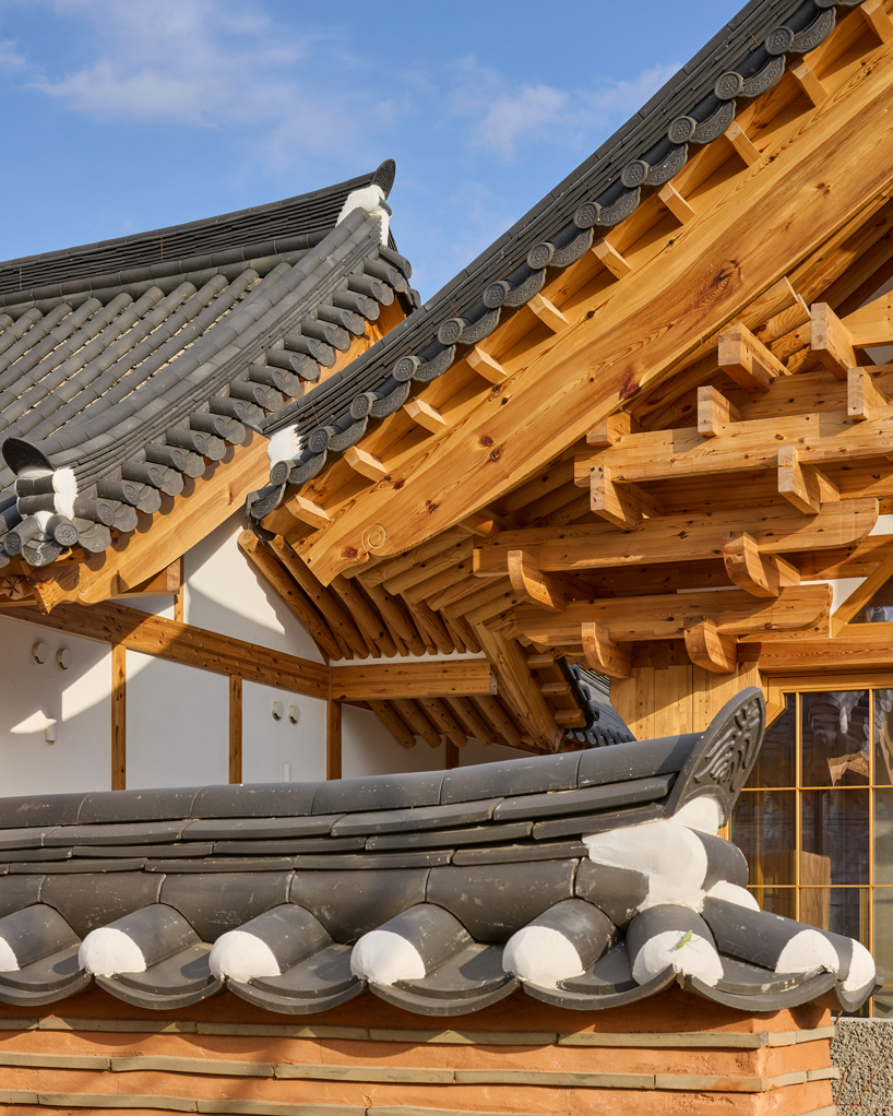three timber rejuvenation halls by JK-AR surround a series of traditional korean courtyards - 6