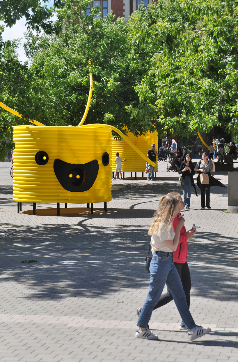 friendly yellow giants connect strangers and friends at orebro square in sweden 1