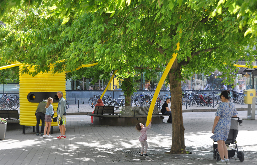 friendly yellow giants connect strangers and friends at orebro square in sweden 10