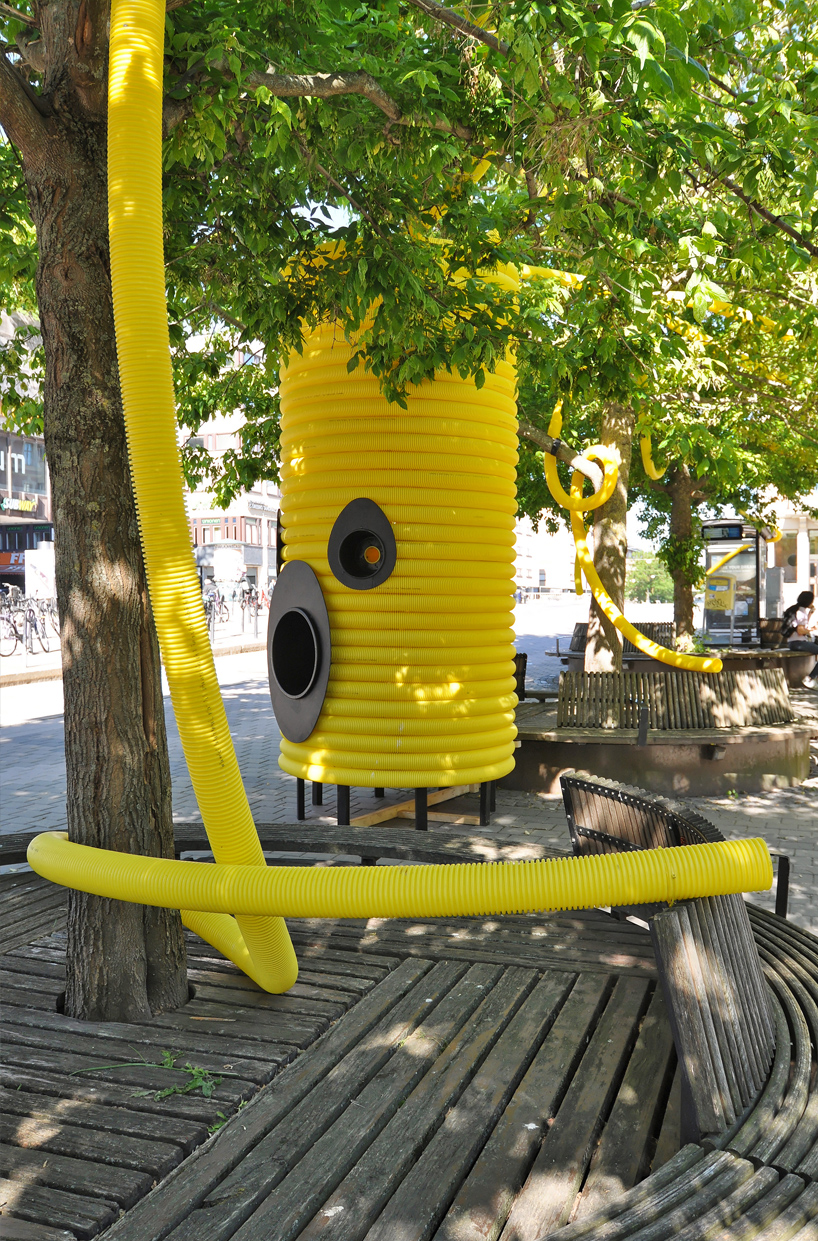 friendly yellow giants connect strangers and friends at orebro square in sweden 11