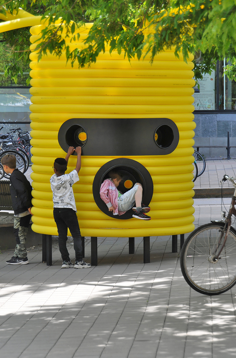 friendly yellow giants connect strangers and friends at orebro square in sweden 2