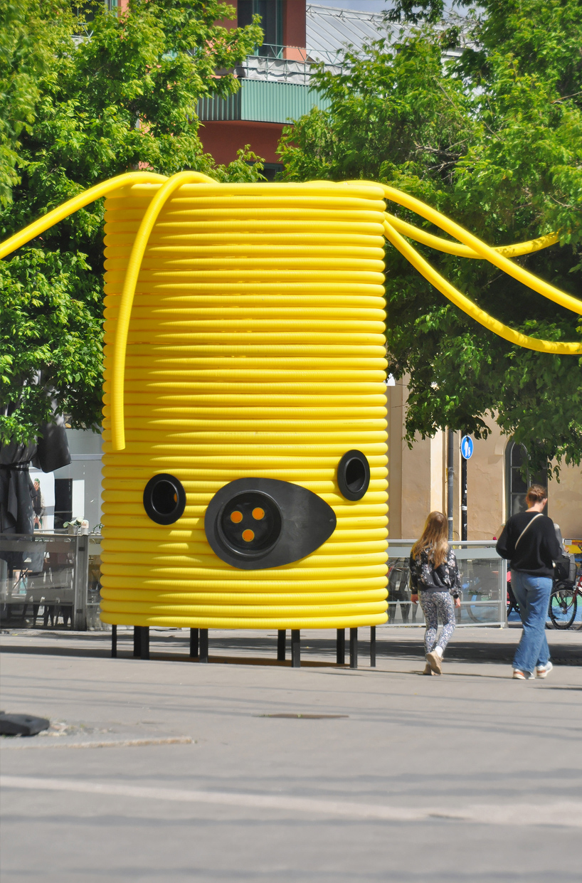 friendly yellow giants connect strangers and friends at orebro square in sweden 5