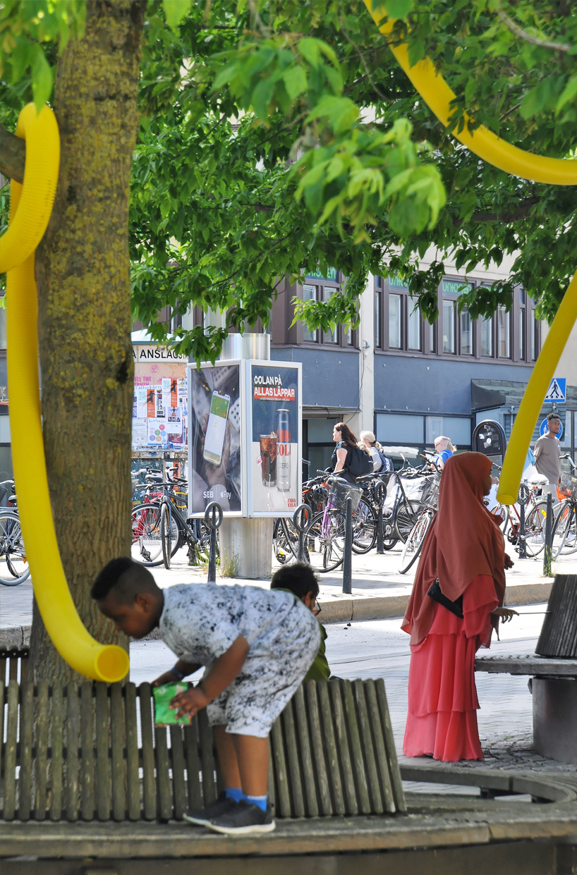 friendly yellow giants connect strangers and friends at orebro square in sweden 7