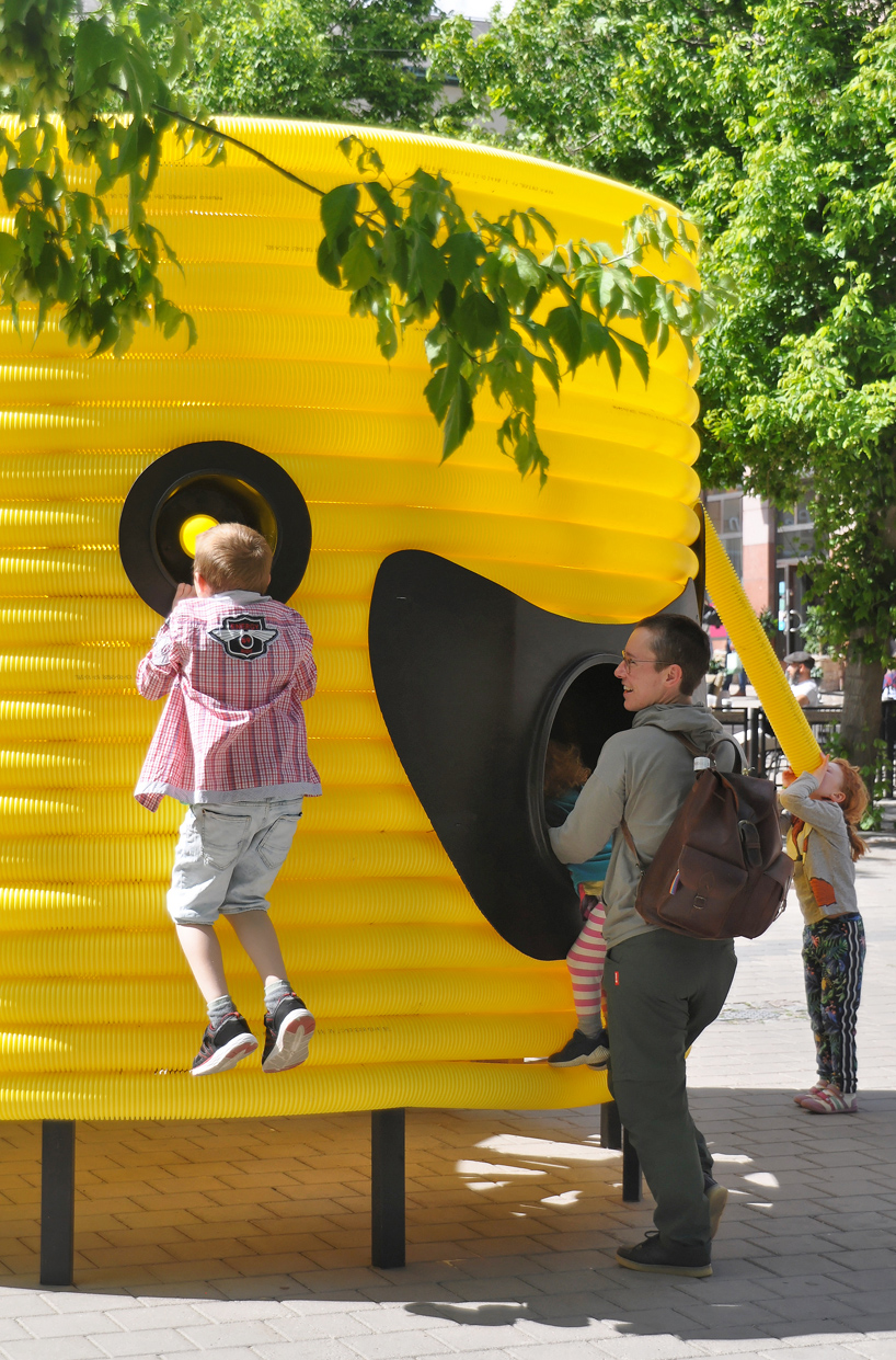 friendly yellow giants connect strangers and friends at orebro square in sweden 8