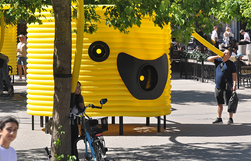 friendly yellow giants connect strangers and friends at orebro square in sweden 9