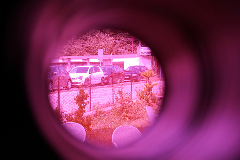 moradavaga's spider sprawls across facade in italy, reminiscent of an old-school string phone