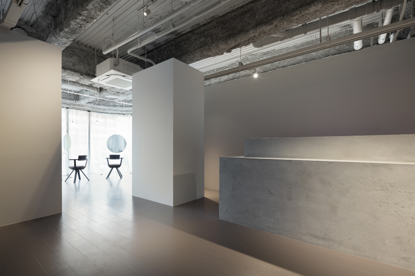 sides core's hair salon 'flux' in kyoto features suspended mirrors as centerpieces of the space