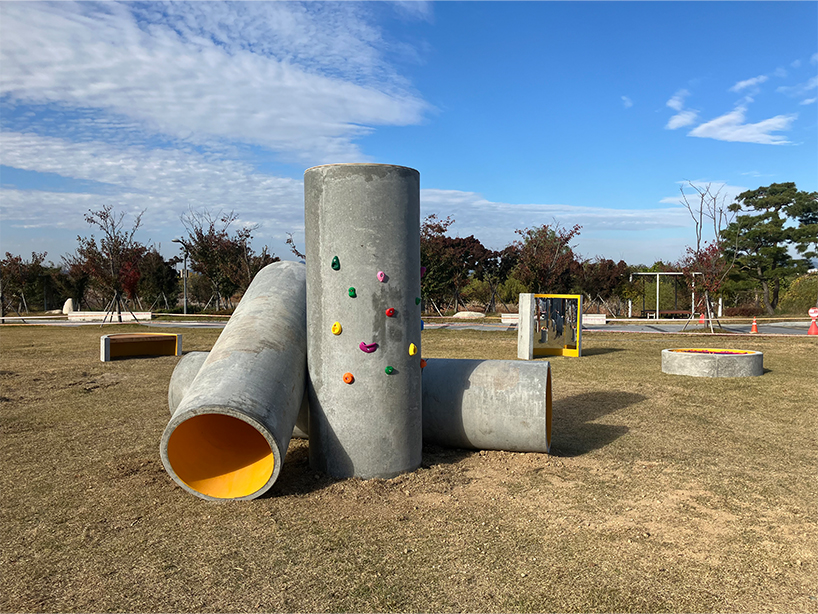 concrete utopia transforms discarded construction pipes into playground in south korea