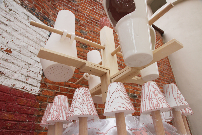 ariane prin creates dripped porcelain vessels with water cups fountain