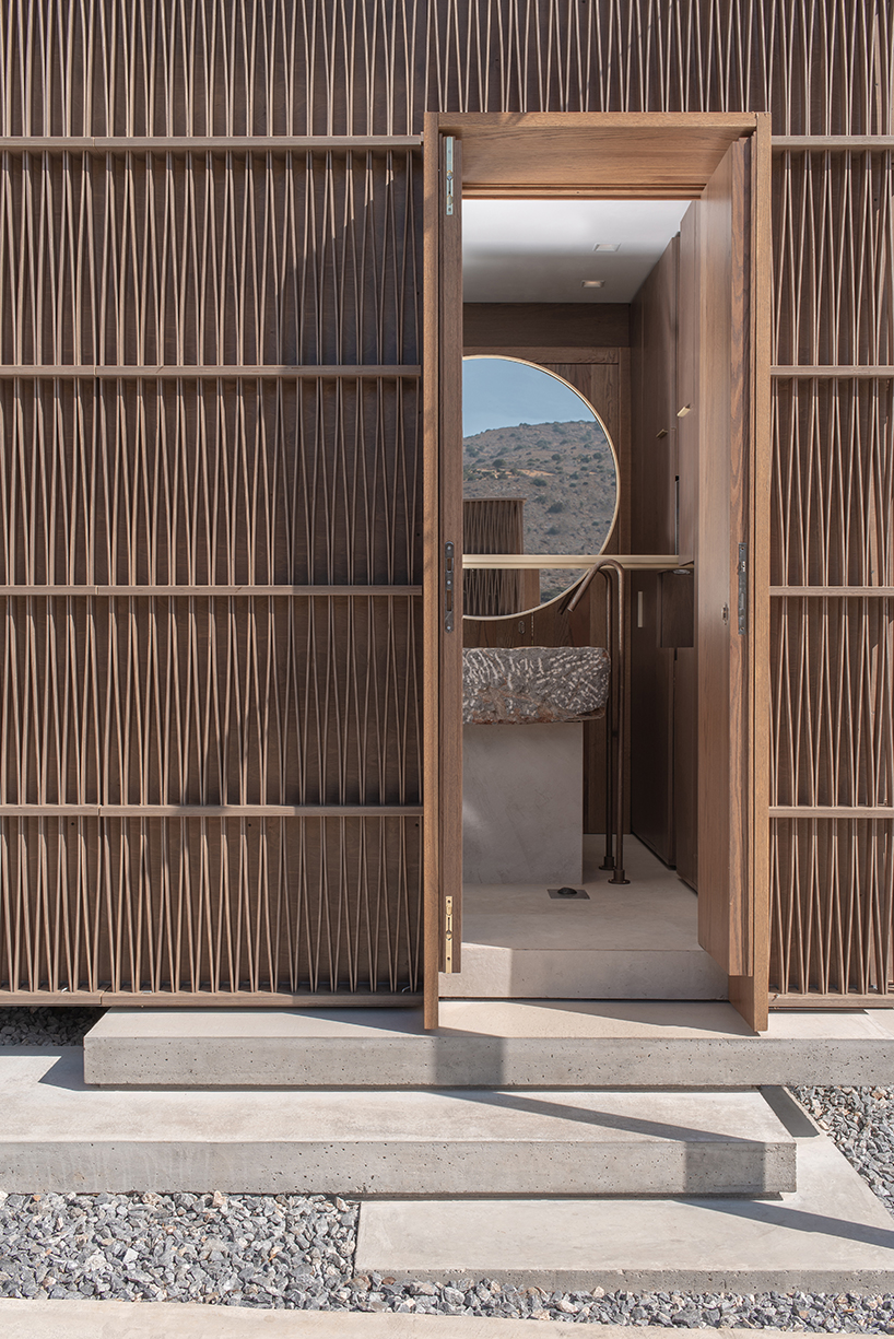 woven timber façades clad a series of box-like pavilions in crete, greece