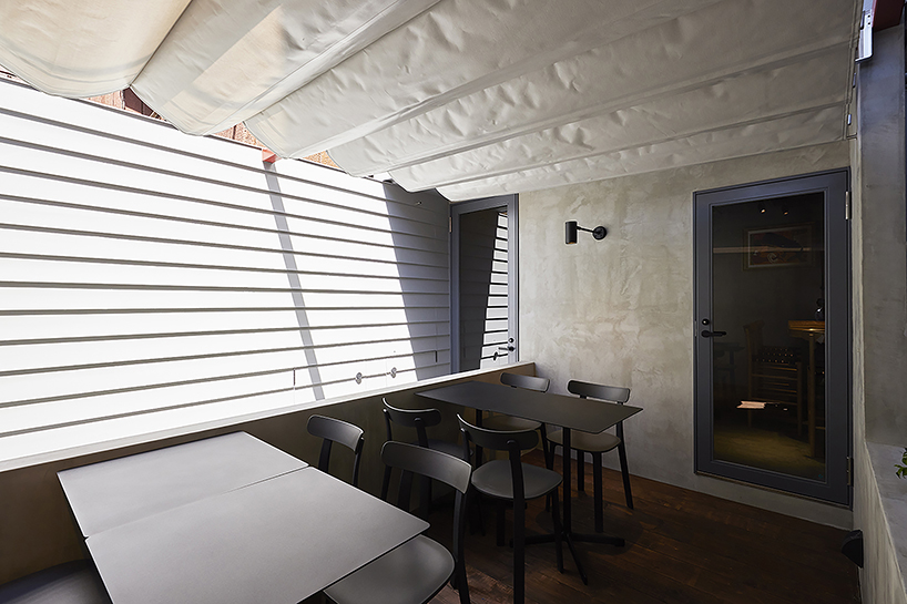 old steel-framed house converts into vibrant restaurant in tokyo