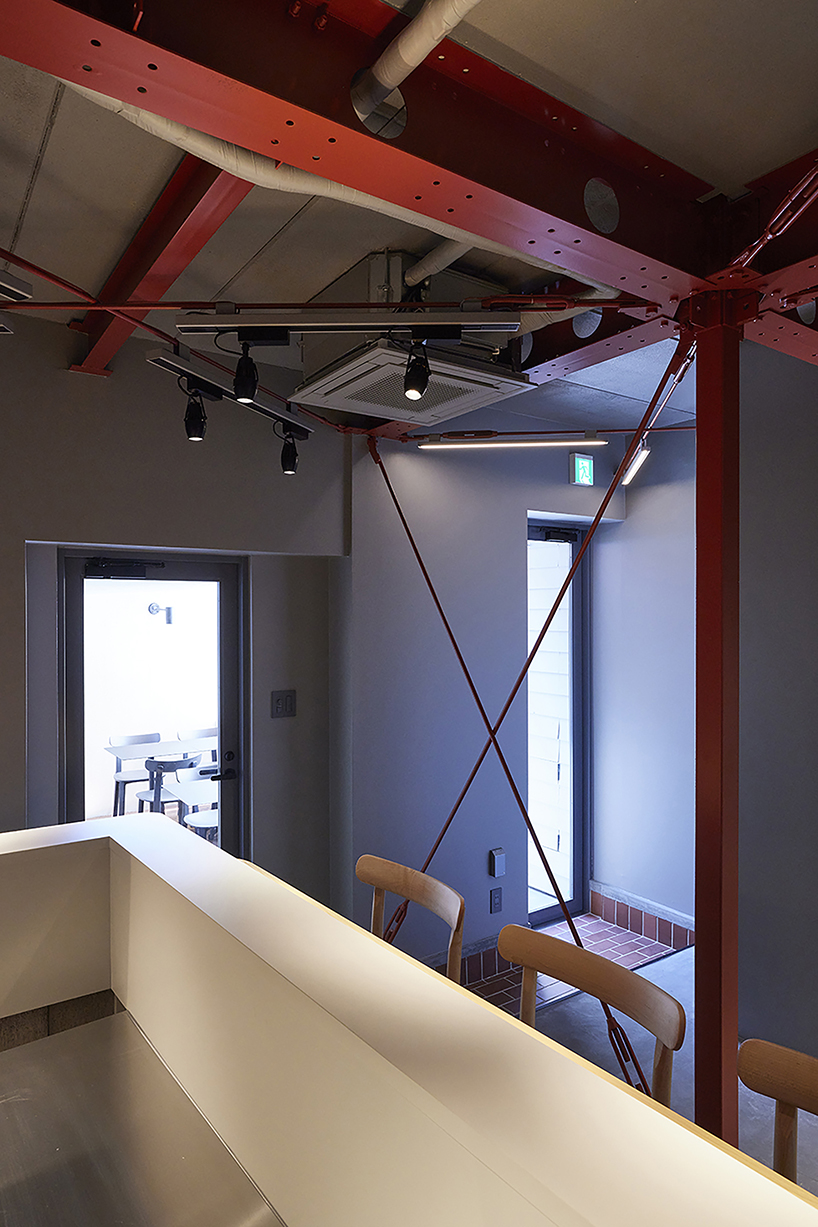 old steel-framed house converts into vibrant restaurant in tokyo