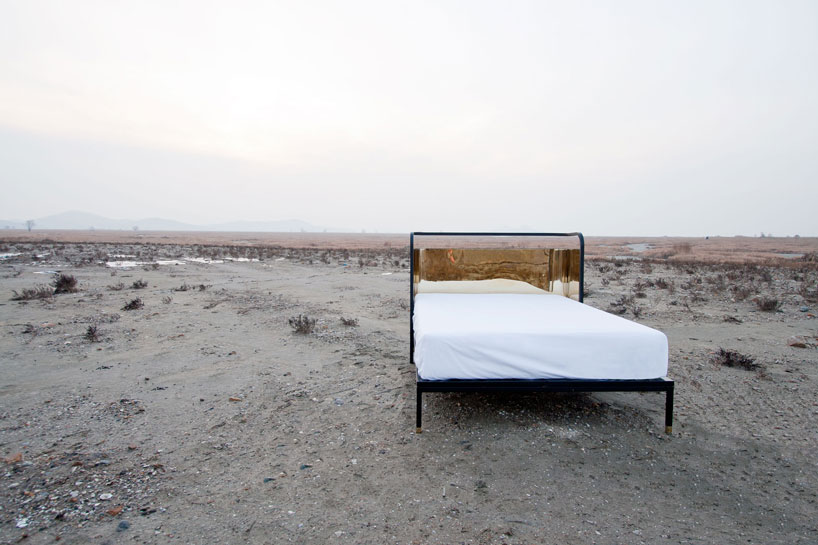 gold reflective head board bed by young hwan shin of nordic bros