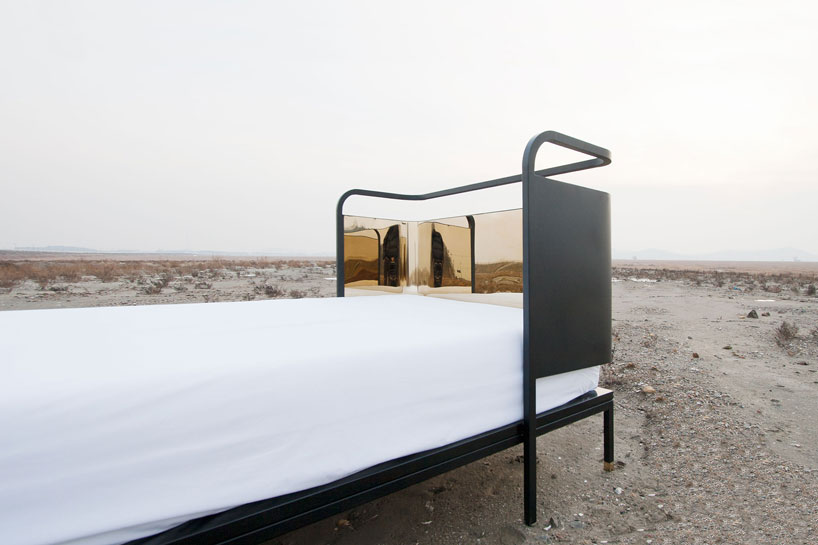 gold reflective head board bed by young hwan shin of nordic bros