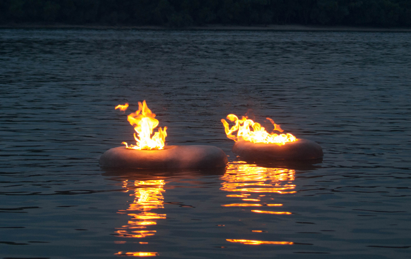 AB concrete design's glowing flambeaus that floats in water 