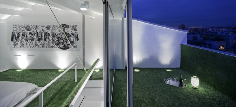 OHLAB greens an urban penthouse shelter in madrid